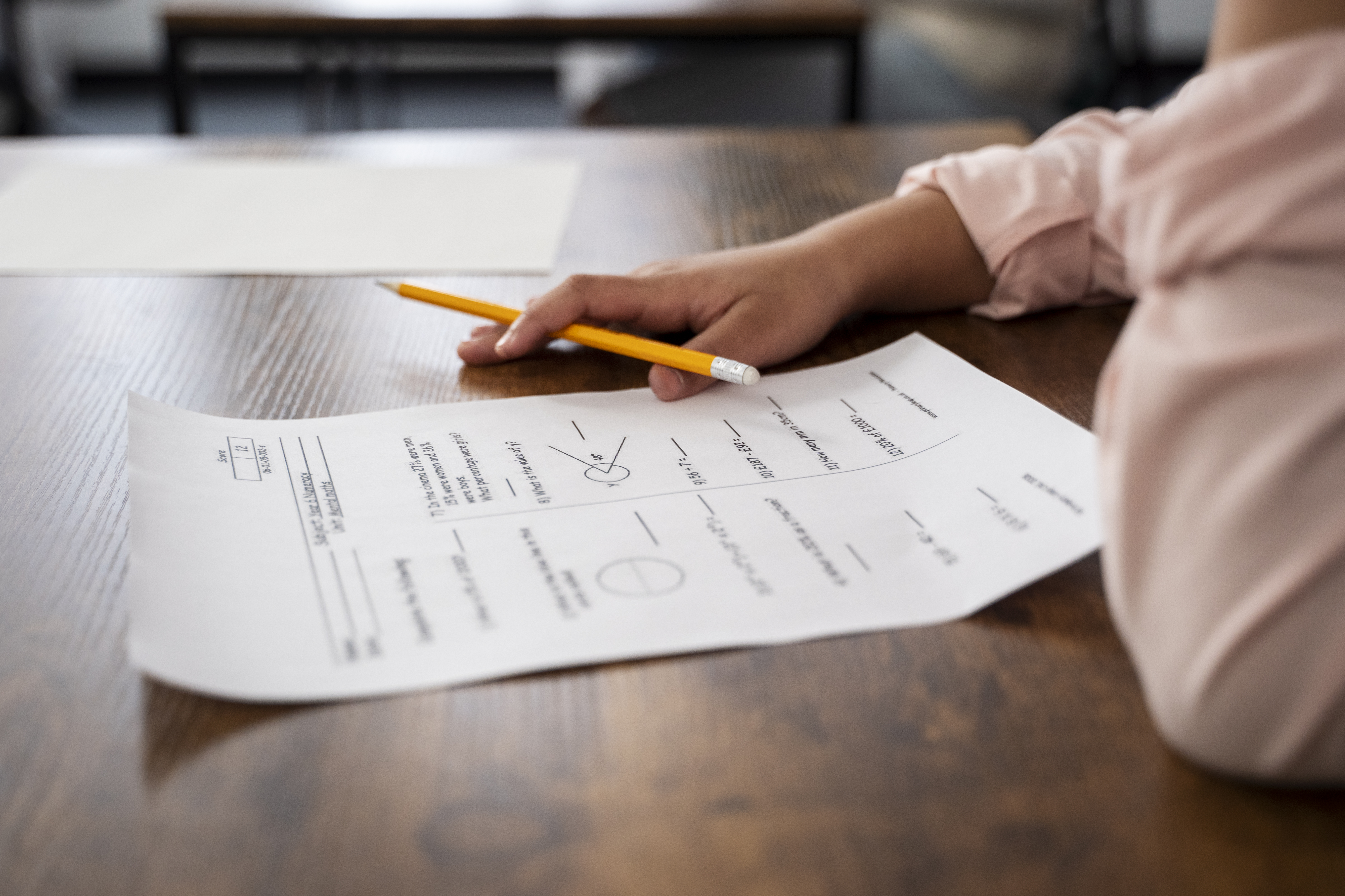 side view kid cheating school test